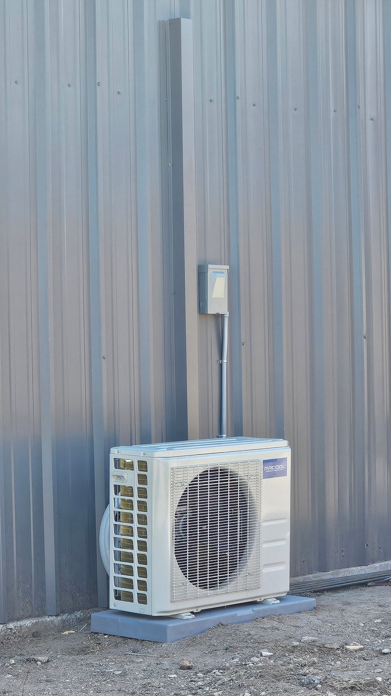 MRCOOL outdoor mini split condenser installed on composite pad